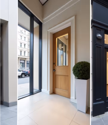 Stylish residential entryway with a wooden front door and glass panels, flanked by tall windows and a decorative potted plant.